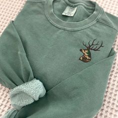 Embroidered Hunter Sweatshirt, Camo Deer Crewneck Pullover, Mens Buck Pullover, Gifts for Dad, Gift for Him, Wildlife Enthusiast by TiffanysCustomCuties on Etsy Embroidered Clothes Men, Filipino Flashcards, Hunter Christmas Shirt, Camo Crewneck, Hunting T Shirt, Hunting Apparel, Hunting Tshirt, Deer Sweatshirt, Etsy Ideas