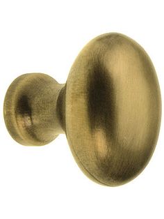 an antique brass door knob on a white background