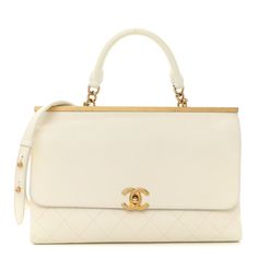 This is an authentic CHANEL Lambskin Quilted Coco Luxe Top Handle Flap in White. This chic shoulder bag is crafted of diamond-quilted calfskin leather in white. The bag features an aged gold bar frame at the top, with a rolled leather top handle and a matching gold chain-link shoulder strap. The front flap opens with a classic CC turn-lock to a partitioned beige fabric interior with zipper and patch pockets. White Bags With Cc Turnlock Closure For Evening, White Evening Bag With Cc Turnlock Closure, Elegant White Shoulder Bag With Cc Turnlock Closure, White Leather Shoulder Bag With Cc Turnlock Closure, Designer White Shoulder Bag With Cc Turnlock Closure, White Shoulder Bag With Cc Turnlock Closure, White Quilted Bag For Formal Occasions, Luxury White Shoulder Bag With Cc Turnlock Closure, White Quilted Evening Bag