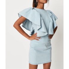 Short Extreme Ruffle Sleeve Denim Dress In A Stretchy Fabric With An Exposed Back Zip. Regular Fit Mini - Sits Mid Thigh 73% Cotton 25% Polyester 2% Elastane Fitted Denim Dress With Ruffle Hem, Blue Cotton Ruffle Dress For Spring, Spring Blue Cotton Ruffle Dress, Chic Denim Mini Dress With Ruffles, Fitted Mini Denim Dress With Ruffles, Sleeveless Blue Denim Dress With Ruffles, Blue Sleeveless Denim Dress With Ruffles, Blue Mini Dress With Frayed Hem, Ruffled Short Sleeve Denim Dress