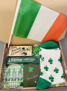 a box filled with lots of goodies for st patrick's day and the irish flag