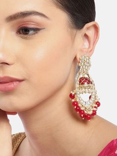 These beautiful maroon (deep red) dome shaped jhumka earrings come with kundan stone studs & beads, are gold-plated and are secured with a post and back closure. These handcrafted jhumkas can be paired with any traditional outfit to add a punch of colorful boost, and help you stand out. Product color may vary based on the monitor or screen you are using.See FAQ for more details. Size Length: 9.5 cm Details Material: BrassStones: Kundan & Artificial BeadsPlating: Gold-plated Ruby Meenakari Jhumkas For Festivals, Bollywood Style Ruby Chandbali Jhumkas, Heavy Ruby Jhumkas For Festive Occasions, Festive Heavy Ruby Jhumkas, Diwali Ruby Meenakari Jhumkas, Traditional Ruby Chandbali Jhumkas, Bollywood Style Ruby Jhumkas With Latkans, Bollywood Ruby Jhumkas With Latkans, Bollywood Ruby Jhumkas For Festivals