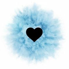 a black heart surrounded by blue powder