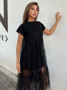 Ang Nikki Mesh Dress ay ang perpektong timpla ng kaswal at chic.  Sa isang tuwid na silhouette, ang damit na ito ay nagtatampok ng mga maikling manggas at isang O-neckline, na ginagawang angkop para sa parehong araw at gabi na mga kaganapan.  Ang damit ay gawa sa kumportableng timpla ng cotton, polyester, at mesh, na tinitiyak na ito ay malambot at magaan na isusuot.

Ang damit ay maluwag, nagbibigay ng kaginhawahan at kadalian ng paggalaw, at may bahagyang kahabaan para sa isang nakakabigay-pu Short Sleeve Mini Dress For Summer Night Out, Mini Short Sleeve Dress For Summer Nights, Chic Cotton T-shirt Dress For Spring, Summer Mini Dress For Night Out With Short Sleeves, Summer Night Out Mini Dress With Short Sleeves, Black Short Sleeve Midi Dress For Spring, Black Cotton Dress With Short Sleeves, Cotton Short Sleeve Dress For Casual Wear, Casual Black Mini Short Sleeve Dress