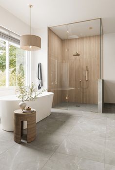 a bathroom with a large tub and walk in shower