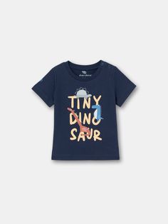 This tee is the ultimate combination of cool and cozy! With its eye-catching Tiny Dino print is sure to turn heads and make a statement. Made from high-quality materials, it's soft, warm, and perfect for any occasion. Blue Fun T-shirt For Playtime, Blue Graphic Tee T-shirt With Slogan, Blue Graphic Tee With Slogan, Unisex Short Sleeve T-shirt For Playtime, Screen Print Short Sleeve T-shirt For Playtime, Blue Short Sleeve Slogan T-shirt, Playful Short Sleeve Graphic T-shirt, Casual Letter Print T-shirt For Playtime, Playful Blue Top With Funny Print