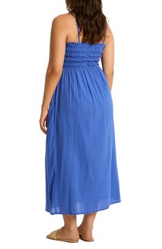 This strapless cover-up dress is crafted of from cotton and designed with a smocked bodice that leads to a flowy skirt. 44" center front length (size Medium) Slips on over head Strapless Smocked bodice 100% cotton Hand wash, dry flat Imported Sundress With Smocked Bodice And Bandeau Shape, Bandeau Sundress With Smocked Bodice, Strapless Midi Dress With Smocked Back For Summer, Ruched Beach Cover-up Dress For Beach Season, Summer Strapless Ruched Cotton Dress, Summer Cotton Strapless Ruched Dress, Ruched Dress For Beach Cover-up, Summer Strapless Cotton Dress With Ruched Detail, Ruched Dress For Beach Season Cover-up