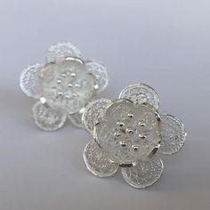 "Silver Flower Earrings Flor de Primavera - Filigree Earrings - Filigree Jewelry - Silver Stud Earrings - Flower Studs - Flower Stud Earrings Filigree - delicate jewellery technique made from silver or golden threads \"embroidering\" kind of metalwork lace that is specific to Spain, especially an Andalusian town Cordoba, where they call it a cordobese filigree. This craftsmanship has been passed from generation to generation, nonetheless nowadays there are very few craftsmen left who know to per Orchid Earrings, Delicate Jewellery, Silver Flower Earrings, Filigree Jewelry, Filigree Earrings, Flower Stud Earrings, Generation To Generation, Earrings Flower, Wedding Inspirations