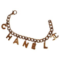 Rare chanel logo charm bracelet in excellent condition. Playful yet classy piece of jewelry. Comes with its box. Luxury Gold Chain Charm Bracelet, Chanel Bracelet Gold, Luxury Yellow Gold Chain Charm Bracelet, Luxury Gold-tone Chain Charm Bracelet, Chanel Bracelet, Chanel Logo, Charm Chain, Silver Charm Bracelet, Gold Logo