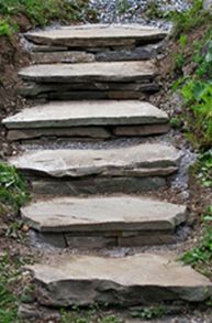 stone steps leading up to the top of a hill