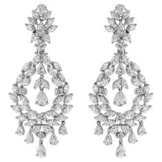 With timeless design and dazzling diamonds, these earrings are a showstopper. Diamonds Shapes: Round, Marquise & Pear Total Diamond Weight: 11.18 ct Diamond Color: G - H Diamond Clarity: VS (Very Slightly Included) Metal: 18K White Gold Metal Wt: 26 gms Setting: Prong Set Length: 2.5 Inches (6.35 cm) Non Threaded Post + Omega Back & Push Back Closure Glamorous Brilliant Cut Bridal Earrings For Formal Occasions, Glamorous Brilliant-cut Bridal Earrings For Formal Occasions, Glamorous Brilliant Cut Bridal Earrings For Formal, Dazzling Diamond Chandelier Earrings For Formal Occasions, Formal Diamond White Chandelier Earrings With Brilliant Cut, Formal Chandelier Earrings With Brilliant Cut Cubic Zirconia, Diamond White Chandelier Earrings For Formal Occasions, Formal Diamond Chandelier Earrings, Dazzling Brilliant Cut Chandelier Earrings For Evening