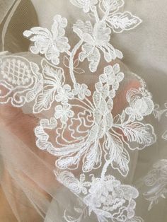 close up of white lace on fabric