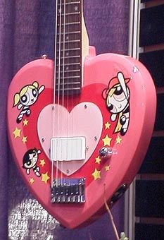 a pink guitar with cartoon characters on it