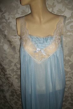 A vintage 70s baby blue nylon and lace long nightgown,  Adorable , lace botice and lace shoulder straps. Size Medium but Measurements are BUST-(underarm to underarm) 18" across or 36" round                                                          WAIST-23" across or 46" round                                                         LENGTH-52" long (top of shoulder to bottom) This is a soft soft loose fitting comfy gown. Good Condition Looks unused. Vintage 70s nylon and lace nightgown by Spotligh Vintage Blue Wedding Nightgown, Blue Vintage Wedding Nightgown, Blue Sheer Sleeveless Nightgown, Blue Sheer Lace Sleepwear, Blue Sleeveless Lace Sleepwear, Blue Lace Sleeveless Sleepwear, Vintage Blue Sheer Sleepwear, Blue Sheer Vintage Sleepwear, Vintage Light Blue Sleepwear With Lace Trim