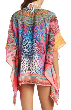 Unleash your free boho spirit in this poncho styled with vivid allover patterns and beaded embellishments. 28'' length (OS) V-neck Kimono sleeves All-over print Woven 100% polyester Dry clean Imported Model stats: 5'10", 32" bust, 25" waist, 36" hip. Model is wearing size OS. Bohemian Multicolor Print V-neck Kaftan, Bohemian Multicolor Tunic Cover-up, Multicolor Printed Cover-up With Kimono Sleeves, Bohemian Multicolor Printed Cover-up, Casual Multicolor Boho Print Cover-up, Bohemian Summer Kaftan With Bold Print, Multicolor Poncho For Beach Cover-up In Summer, Multicolor Boho Print Kaftan For Festival, Hippie Multicolor Kaftan With Kimono Sleeves