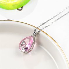 Add some sparkle to your everyday ensembles with this fine silver-plated pendant necklace that features pink crystal and glittering cubic zirconia accents. Chain: 18'' L 0.51'' W x 0.71'' L Lobster claw clasp Fine silver-plated copper / cubic zirconia /?crystal Pink Cubic Zirconia Rhinestone Necklace As Gift, Pink Crystal Necklaces For Mother's Day, Pink Crystal Necklace For Mother's Day, Mother's Day Pink Crystal Necklace, Silver Drop Rhinestone Necklace As Gift, Silver Drop Rhinestone Necklace For Gifts, Teardrop Crystal Rhinestone Necklace For Gift, Wedding Jewelry For Bride, Topaz Necklace