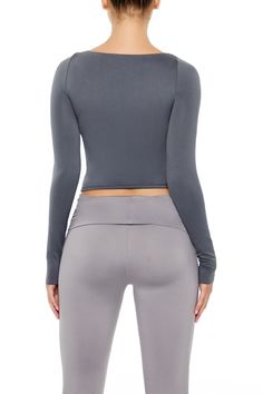 Seamless knit top featuring round neckline, long sleeves, and semi - cropped hem. | 93% nylon, 7% spandex | Machine wash cold | Model is 5'9" and wearing Small | Seamless Long - Sleeve Top Semi Cropped, Round Neckline, Knit Top, Long Sleeve Tops, Sleeve Top, Long Sleeves, Spandex, Knitting, Long Sleeve