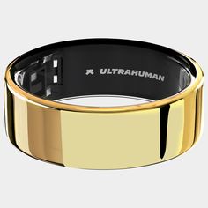 a black and gold ring with the words ultrahuman on it's side