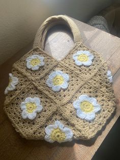 This Daisy Market Bag is a perfect purse or accessory for going out! Trendy Handmade Bags For Spring, Handmade Trendy Bags For Spring, Pouch Crochet Bag For Errands, Cute Beige Square Bag, Trendy Rectangular Crochet Bag For Errands, Cute Square Bag For Spring, Cute Everyday Crochet Rectangular Bag, Trendy Cream Crochet Square Bag, Trendy Cream Square Crochet Bag