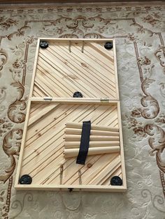 a clock made out of bamboo sticks on top of a rug