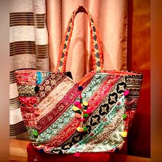 This Is A Beautiful And One Of A Kind Summer Large Size Boho Tote. A True Show Stopper. With One Large Zippered Compartment And Two Pockets In It. It Is Well Structured So This Bag Keeps Its Shape Nicely. Can Be Worn To The Beach, And Is Perfect For Your Day-To-Day Use. Has A Lot Of Beautiful Decorative Eye-Catching Details. All Handmade In India For Italian Brand. It Is Gorgeous! Bohemian Large Capacity Hobo Bag For Shopping, Bohemian Rectangular Hobo Bag For Shopping, Multicolor Bohemian Shoulder Bag With Removable Pouch, Bohemian Multicolor Shoulder Bag With Removable Pouch, Multicolor Bohemian Bags For Daily Use, Bohemian Multicolor Bags For Daily Use, Bohemian Hobo Bag For Shopping, Colorful Bohemian Shoulder Bag, Vibrant Multicolor Bags For Summer