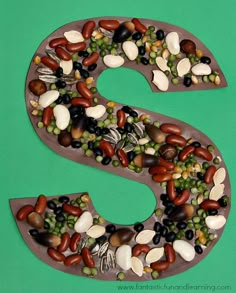 the letter s is made up of nuts and seeds