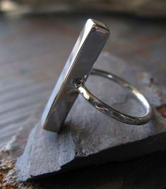 Thick sterling silver modern bar ring. Quality artisan made. Polished finish jewelry. Textured band. Modern Sterling Silver Hammered Rings, Modern Sterling Silver Hand Forged Stackable Rings, Modern Hand-forged Sterling Silver Stackable Rings, Minimalist Hand Forged Silver Stackable Rings, Minimalist Hand-forged Silver Stackable Rings, Modern Hand Forged Silver Stackable Rings, Minimalist Sterling Silver Rectangular Stackable Rings, Minimalist Sterling Silver Stackable Rectangular Rings, Bar Ring