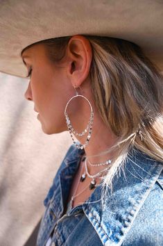 Business at the top, party at the bottom! Captivating and airy, our Silver Coin Hoop Earrings are the perfect accessory to zest up any look! These beauties are so lightweight, you may even forget they are there, but they are sure to catch the eye of those around you. 2" silver plated hammered hoops with coin chain Weight: .11 oz Drop length approx: 3 7/8" Handmade in Arizona Also available in gold Bridesmaids Earrings, Bridal Earrings Chandelier, Tarnished Jewelry, Bold Earrings, Meaningful Jewelry, Sterling Jewelry, Large Hoop Earrings, Silver Coin, Girls Earrings