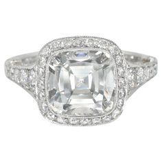 Tiffany Cushion Diamond 'Legacy' Ring. This ring has a center cushion diamond weighing a 3.08 carat (Color: G, Clarity:VS1), setting in platinum with round diamonds down the split shank weighing 0.83 carat. Center diamond Inscribed T&Co. H08230188. Signed Tiffany & Co., PT950, Pat. D467 Center diamond comes With Tiffany & Co certificate . #22157809 G -VS1 3.08 carat Finger Size: 5.75 Gia Certified Cushion Cut Diamond Ring, Classic Gia Certified Square Cut Diamond Ring, Fine Jewelry Asscher Cut Halo Ring In Platinum, Fine Jewelry Platinum Halo Ring With Asscher Cut, Classic Square Cut Gia Certified Diamond Ring, Asscher Cut Platinum Halo Ring, Fine Jewelry, Platinum Asscher Cut Halo Ring Fine Jewelry, Gia Certified Luxury Square Cut Diamond Ring, Gia Certified Dazzling Cushion Cut Diamond Ring