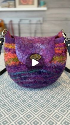 a purple bag with a video on it