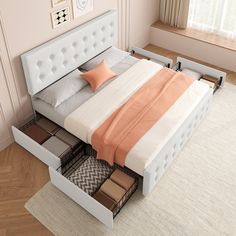 a bed with drawers underneath it in a room