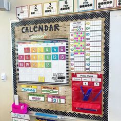 a bulletin board that has calendars on it