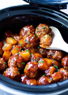 crock pot hawaiian meatballs in a slow cooker with a wooden spoon and text overlay