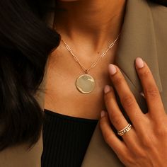 Our sleek and stylish DRD Paperclip Disc Charm Necklace adds modern sophistication to any look. The large, polished gold pendant pairs cleanly with our coveted 14 karat gold paperclip chain. This wear-with-everything necklace is a timeless addition to any neck stack. Want to make it more personal? Add engraving, or your favorite charms to make this piece truly unique! 14 Karat Gold Disc is 25.2mm in Diameter Adjustable Length 20" Paperclip Chain To add a heart to your engraving, use "*" in the text box above. Please note engraving will add up to 10 days to delivery time To add a custom charm, please email info@danarebeccadesigns.com Additional Charms Sold Separately 14k Gold Paperclip Chain Chain Length: 20" Links Measure 9.9mm x 2.5mm Lobster Clasp Minimalist Gold Chain Jewelry With Initial Pendant, Minimalist Gold Chain With Initial Pendant, Modern Gold-plated Jewelry With Paperclip Chain, Modern Rose Gold Jewelry With Cable Chain, Modern Polished Chain Necklace As Gift, Modern Polished Chain Necklace For Gift, Luxury Everyday Necklaces With Polished Finish, Modern 14k Gold Chain Necklace With Polished Finish, Modern 14k Gold Necklace For Everyday