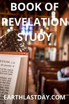 an open book sitting on top of a wooden table in front of a church pew