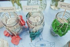 three jars filled with candy sitting on top of a table