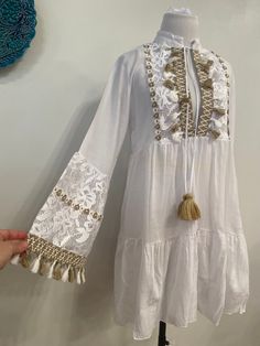 A white boho style mini dress tunic with tassel and lace details great for beach, pool, yachting and comfortable outfit FABRIC : 100%cotton sizes size 36 bust :85 cm size 38 bust: 89 cm size 40 bust:93cm size 42 bust ;97cm Cotton Long Sleeve Dress For Beach Season, Long Sleeve Mini Dress As Beach Cover-up, Long Sleeve Cotton Dress For Beach Season, Long Sleeve Mini Dress For Beach Cover-up, Long Sleeve Boho Dress For Beach, Long Sleeve Cotton Mini Dress For Vacation, Long Sleeve Boho Dress As Beach Cover-up For Spring, Bohemian Long Sleeve Beach Dress For Brunch, Summer Long Sleeve Tunic For Brunch