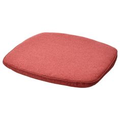 a red cushion sitting on top of a white floor