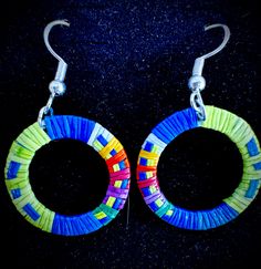 1 inch circle -shaped earrings made with colorful porcupine quills by native artist, Chuck Mesteth Colorful Handmade Round Jewelry, Colorful Small Hoop Earrings With Ear Wire, Colorful Round Earrings Gift, Colorful Circular Jewelry As Gift, Colorful Round Earrings For Gift, Colorful Handmade Small Hoop Jewelry, Colorful Handmade Small Hoop Earrings, Traditional Multicolor Small Hoop Earrings, Traditional Small Hoop Multicolor Earrings