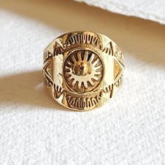 Solid brass sun design ring with tribal modern style design. The natural handcrafting markings render a unique perfectly imperfect character to each piece. Arrives in logo drawstring protective pouch Handmade Symbolic Brass Engraved Ring, Handmade Symbolic Engraved Brass Ring, Adjustable Brass Sun And Moon Design Jewelry, Symbolic Handmade Brass Engraved Ring, Vintage Brass Jewelry With Sun And Moon Design, Vintage Adjustable Rings With Sun And Moon Design, Adjustable Vintage Rings With Sun And Moon Design, Spiritual Adjustable Engraved Brass Ring, Artisan Adjustable Rings For Festivals