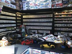 a store filled with lots of toy cars and toys in it's display cases