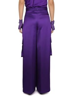 Versace's Wide-Leg Trousers from their SS23 collection. Designed to make a bold statement, these trousers feature a vibrant orchid-purple hue, embodying the experimental and dramatic themes of the collection.Key Features:- Wide-Leg Cut: Offers a roomy fit over the leg while maintaining a close fit at the waist for a flattering silhouette.- Material: Crafted from 100% viscose, a midweight non-stretch fabric, ensuring both comfort and a luxurious feel.- True to Size: These trousers fit true to siz Elegant Full-length Purple Bottoms, Elegant Full Length Purple Bottoms, Chic Purple Evening Bottoms, Elegant Wide-leg Purple Pants, Elegant Wide Leg Purple Pants, Elegant High-waisted Purple Pants, Elegant Purple Pants For Party, Elegant Purple Long Pants, Elegant Long Purple Pants