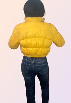 You will be warm, but more importantly, cute in this canary yellow cropped puffer jacket. Features a front zipper, side pockets with snap buttons, a cinched waist, and cinched cuffs. Perfect for the chilly fall and winter weather! Outer: 100% polyester Fill: 100% Polyester Care instructions: Machine washable Cropped Puffer Jacket, Canary Yellow, Winter Weather, Cinched Waist, Fall And Winter, Puffer Jacket, Front Zipper, Care Instructions, Puffer