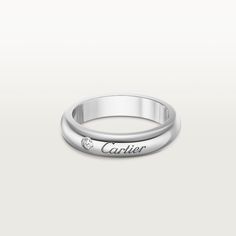 Cartier - C de Cartier wedding band - Ring Diamond/Platinum - C de Cartier wedding band, width 4 mm, platinum 950/1000, set with a brilliant-cut diamond of 0.03 carats (for size 52). Please note that the carat weight, number of stones and product dimensions will vary based on the size of the creation you order. For detailed information please contact us. Wedding Band Width, Cartier Wedding Band, Cartier Wedding Bands, The C, Diamond Rings Bands, Ring Diamond, Brilliant Cut Diamond, Diamond Wedding Bands, Wedding Ring Bands