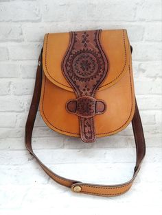 womens accessories womens Bags cross body bag leather Bag Saddle Bag leather shoulder bag Crossbody bag leather crossbody handbag Boho bagHandbags for holidays, meetings and celebrations.The bag is in nice vintage condition Size : 11.4" (29cm)* 10.2" ( 26 cm)Materials -leather.The color on the pictures may vary due to monitor settings and light reflections.We appreciate your patience.Thank you so much for looking at my works!Please do not hesitate to contact with me for any questions.See you. Leather Satchel Shoulder Bag, Leather Saddle Bag With Detachable Strap, Leather Handheld Saddle Bag With Detachable Strap, Leather Shoulder Bag With Mobile Phone Pocket, Leather Satchel Saddle Bag, Leather Tote Mobile Phone Bag, Leather Crossbody Flap Bag For Daily Use, Leather Mobile Phone Tote Bag, Leather Saddle Bag With Adjustable Strap