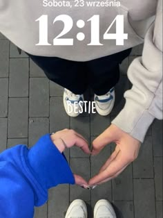 two people making a heart with their hands and the words bestie written in front of them