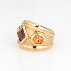 This is part of Chairish’s Fine Jewelry assortment.  Estate David Yurman Renaissance ring crafted in 18 karat yellow.    The out of production David Yurman ring is set with a center set Rhodolite garnet measuring 6mm. Two citrines measure 7mm x 5.5mm. The gemstones are in very good condition and free of cracks or chips. Weighing a hefty 16.6 grams the ring makes a great statement on the hand. The ring has a medium rise (6.5mm - 0.25 inches).  The ring is in very good condition and was recently l Gold Fusion Rings With Gemstone Accents, Yellow Gold Rings With Yellow Sapphire And Accent Stones, Luxury Yellow Gold Rings With Gemstone Accents, Formal Gold Sapphire Ring With Gemstone Accents, Heirloom Gold Sapphire Ring With Gemstone Accents, Classic Yellow Gold Sapphire Ring With Gemstone Accents, Fusion Style 14k Yellow Gold Rings, Heirloom Yellow Gold Rings With Yellow Sapphire, Heirloom Yellow Gold Ring With Yellow Sapphire