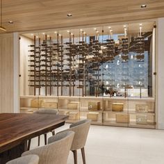 a large wooden table sitting in front of a window filled with lots of glass bottles