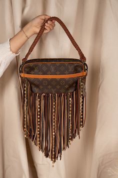 Compact shoulder bag, versatile and cleverly designed, with an exterior front pocket perfect for your essentials. The Riviera is an ideal go-everywhere bag that is lightweight and roomy yet emanates effortless boho-chic. Dimensions: Width: 11.5"x Height: 7.25" Depth: 2.5" Fringe Length: 13.5" Strap Options Option 1: Adjustable crossbody strap that can adjust from 30" to 57" Option 2 (NEW!) Adjustable crossbody and 22" shorty strap Guarantee Of Authenticity We put every bag through a multi-point, Vintage Designer Bags, Beads Pictures, Visa Gift Card, Good Luck To You, Boho Bags, Vintage Boho, Crossbody Strap, Front Pocket, Louis Vuitton Bag