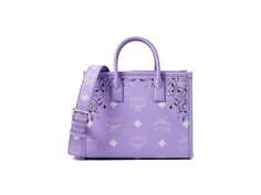 MCM Munchen Visetos Tote Small - Handbags : Bandana Purple Rose : The MCM Munchen Visetos Tote Small is the ideal accessory to store all your essentials while exuding an exquisite vibe. The tote bag comes with two shoulder straps and one wide adjsutable crossbody strap for ease of use. It features a zippered closure, one spacious internal compartment, and intricate design and details on the exteriors. Polyurethane, polyester, and cotton construction. Nylon and polyurethane lining. Imported. Luxury Medium Shoulder Bag For Daily Use, Luxury Medium Shoulder Bag With Detachable Handle, Luxury Medium Shoulder Bag, Luxury Medium Bag With Adjustable Strap, Luxury Medium Satchel With Detachable Handle, Luxury Satchel With Adjustable Handle For Shopping, Luxury Shopping Satchel With Adjustable Handle, Luxury Shoulder Bag With Adjustable Handle For Shopping, Luxury Medium Evening Bag